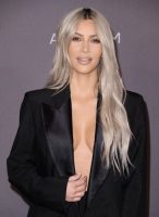 Kim Kardashian bra less wearing black tuxedo